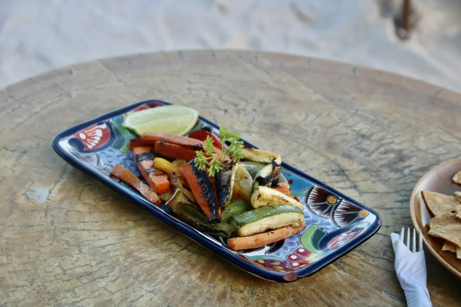 A plate of food on a wooden table
